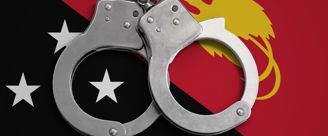 papua new guinea flag and handcuffs