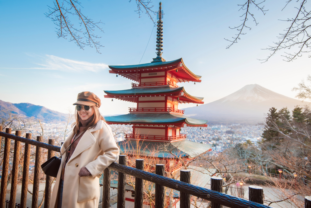Beautiful woman Tourist smiling on Chureito pagoda and Fuji mountain