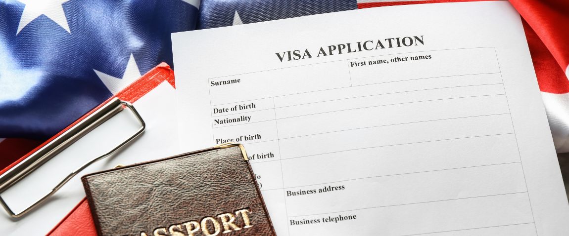 american flag and visa application form