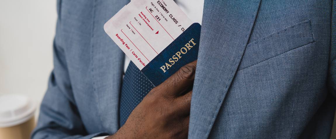 passport and fly ticket into pocket
